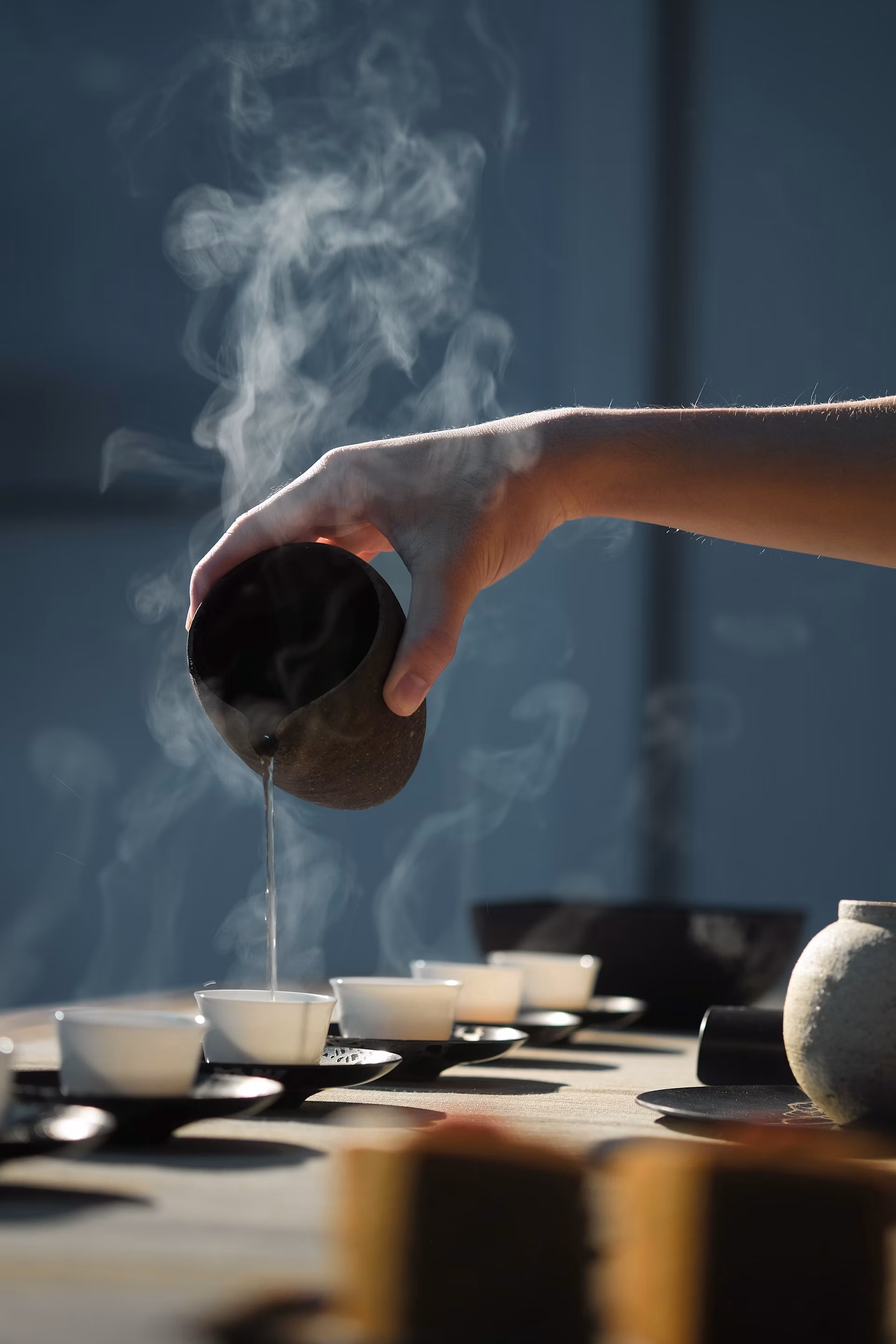 Hot water being poured into a gaiwan